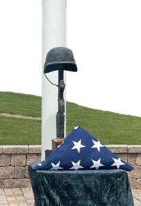 Folded flag and helmet sculpture